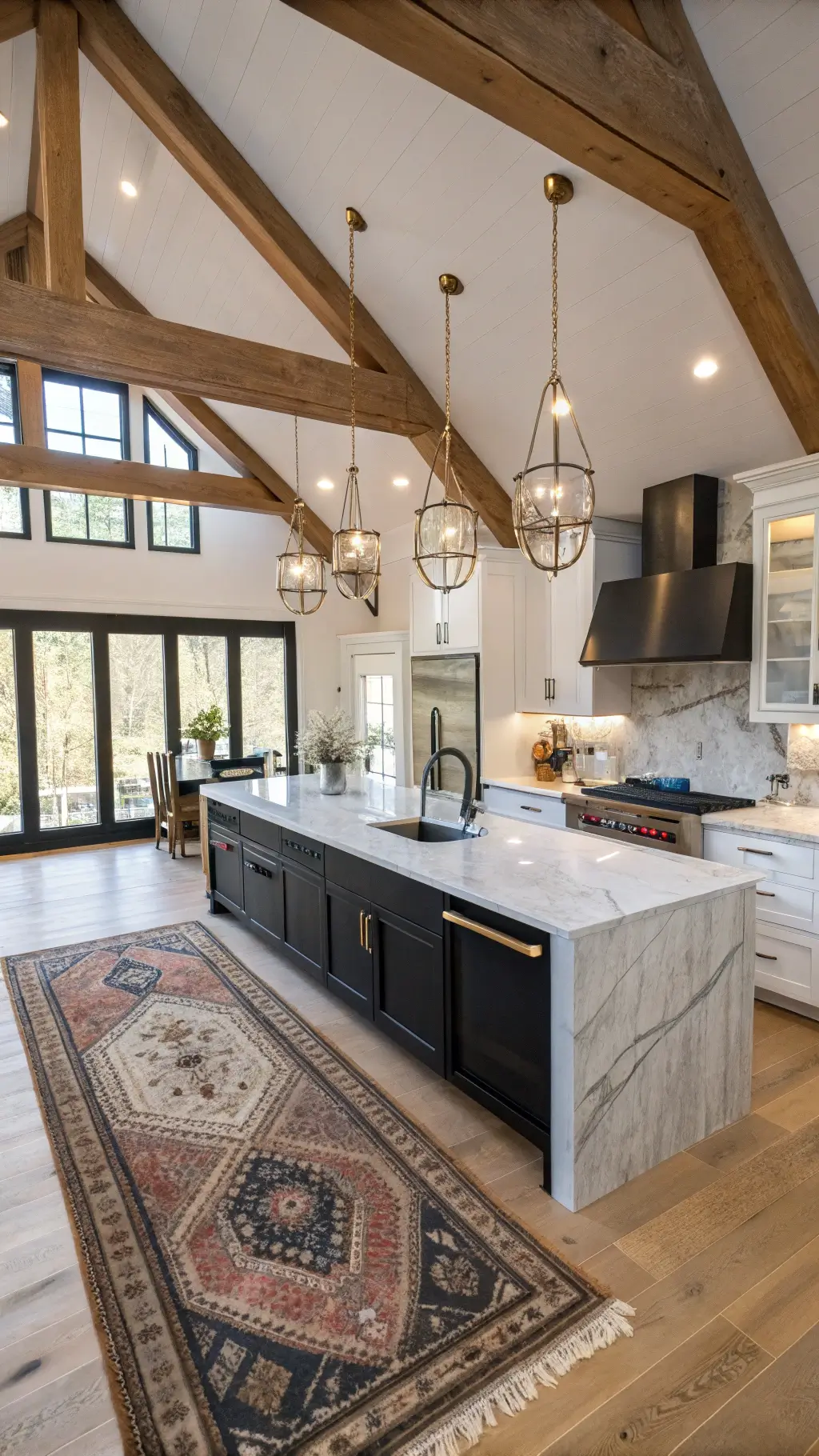 Overhead view of a spacious 16x20ft kitchen with wooden beams, vaulted ceiling, glass pendants, a large marble island with integrated sink, mixed metal finishes, vintage rugs, and wide-plank flooring, illuminated by natural and accent lighting.